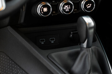 Obraz premium USB port in the car panel close up. Car interior detail. Car usb charger detail.