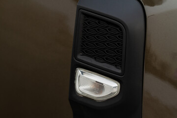 Modern car turn signal side repeater lamp. Car with turn signal repeaters. Car side repeater.