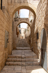 Narrow Alley in the Armenian Quarter of old Jerusalem. Historical streets of Jerusalem