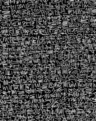 Obraz premium Hand-drawn doodles in white lines on a black background.Abstract drawing on a seamless background.