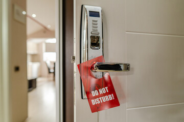 do not disturb sign on the motel or hotel room door handle