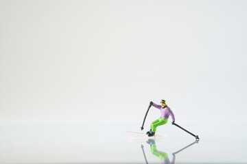 Skier in action on white background