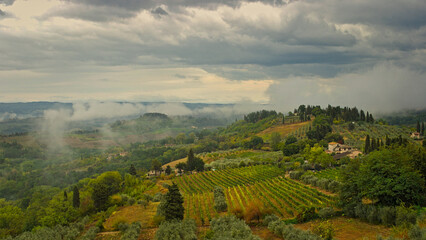 Tuscany landscape with hills and agriculture on a rainy summerday