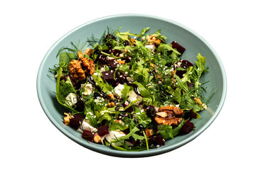 Salad with beets rucola parsley herbs feta cheese walnuts in a bowl on isolated png background.