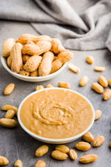 Peanut butter in bowl on kitchen table.