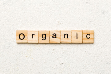 organic word written on wood block. organic text on table, concept
