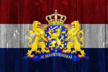 Flag and coat of arms of the Netherlands on a textured background. Concept collage.