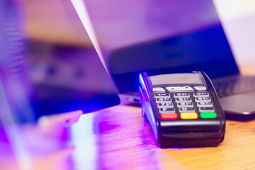 GPRS payment POS terminal on a table with a laptop. Equipment for payment by bank cards.