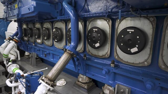 Main engine of vessel. Cylinder covers of diesel inside ship