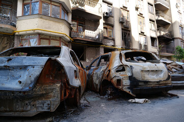 Fototapeta na wymiar Russian terrorist army burned cars, houses and killed people in Irpin, Ukraine
