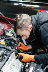 Car mechanic working in a garage