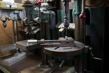 Part machining with drilling machine