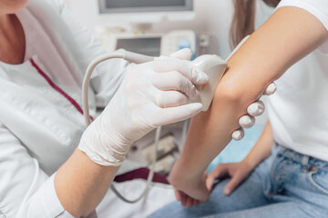Doctor ultrasound examine female patient abdomen at hospital