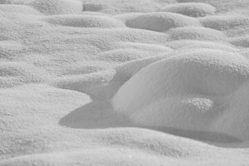 Fototapeta na wymiar Snow drifts are isolated on a white background in shades of gray