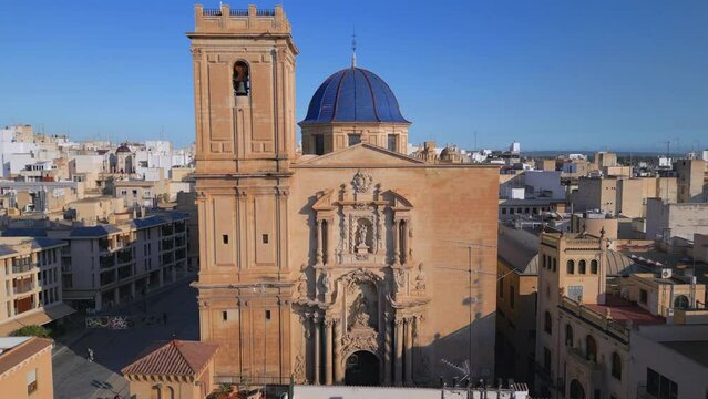 Discover the Beauty of Costa Blanca's Baroque Monument: Aerial Drone Footage of the Basilica Santa Maria in Elche, Spain and its Sculptures. Cinematic Revealing shot