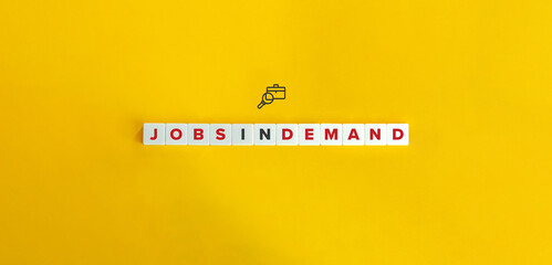 Jobs in Demand and Labour Market Banner and Concept. Letter Tiles on Yellow Background. Minimal...