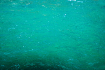 water surface of a turquoise river