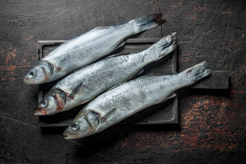 Raw fish on cutting Board.