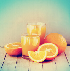 Fototapeta na wymiar healthy fresh orange juice with oranges