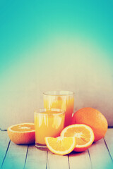 Fototapeta na wymiar healthy fresh orange juice with oranges