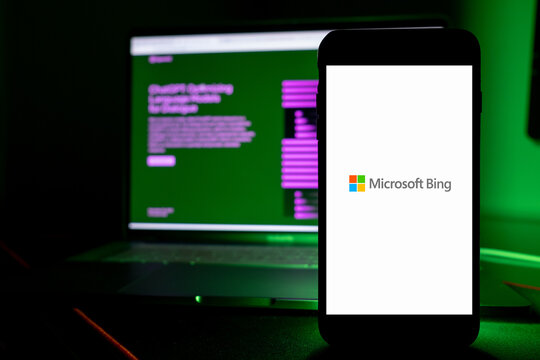 Azores, Portugal - 16.01.2023: SmartPhone Screen with Microsoft Bing Logo, and in the Background defocused the AI ChatGPT home page. Developed by OpenAI.