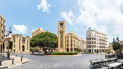 Fototapeta premium Panorama of Nejmeh square in downtown Beirut with the iconic clock tower and the Lebanese parliament building, Beirut, Lebanon