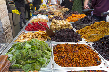 Assorted dried fruits for sale in the market in Jerusalem, Israel. raisins, date, cranberries,  ginger and apricot