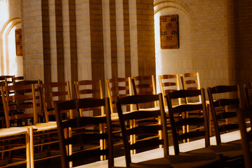 Warm picture of chairs in Grundtvigs Kirke / Church