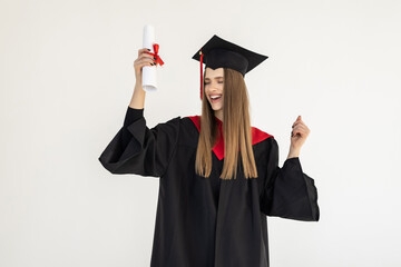 education, graduation and people concept - happy graduate student woman in mortarboard and bachelor...