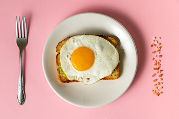 Fried Egg Toast On Plain Pink Background