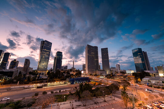 TEL AVIV, ISRAEL - MARCH 1, 2019: Night Aerial view of tel aviv skyline with urban skyscrapers and blue sky, Israel