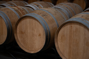 Rows of french and american oak barrels in cellars of winery in Rioja wine making region, Spain