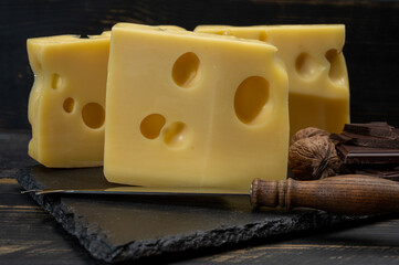 Swiss food, medium-hard cow milk cheese emmentaler with holes, dark swiss chocolate