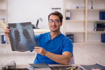 Young male doctor radiologist working in the clinic