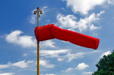 Red windsock inflated of air in heliport in Sao Paulo city, Brazil