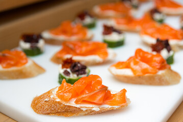 tapas appetizer with salmon and cream cheese, tapas with sun-dried tomatoes