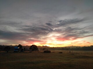 Naklejka na ściany i meble sunrise over the field