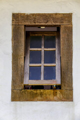 Wooden window in colonial mud wall in countryside of Brazil