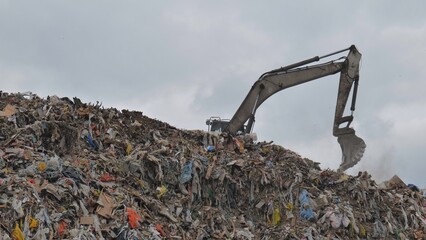 Work of a bulldozer at a landfill.