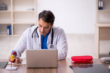 Young male doctor in telemedicine concept