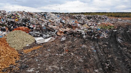 Large landfill near the metropolis in autumn.
