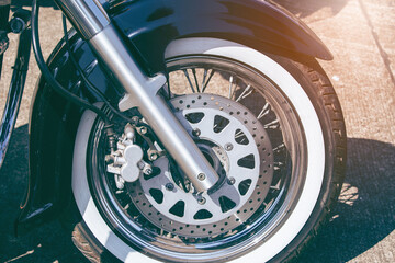 front fork of a motorcycle with a front wheel,