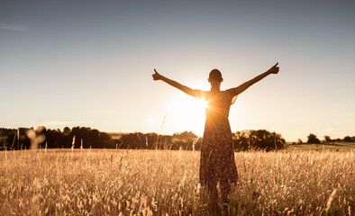 Having a positive mindset, wellbeing and hope concept. Happy young woman standing in a nature...