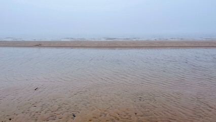 beautiful sandy seashore in fog