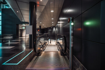 A capture of a contemporary airport, in Zurich, the area with a selective focus is on moving...