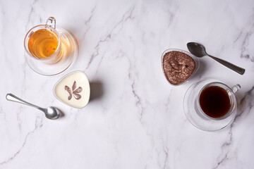 some teas and spoons on a white marble countertopped image is in the top right handout