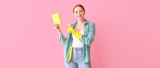 Happy young woman with sponge on pink background