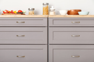 Grey counters with drawers and food in modern kitchen