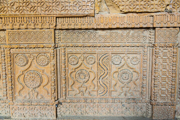Beautiful traditional intricate geometric and floral carved stone detail, decoration, in a royal mausoleum in Makli necropolis in Thatta, Sindh, Pakistan