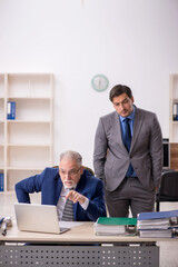 Two male colleagues working in the office